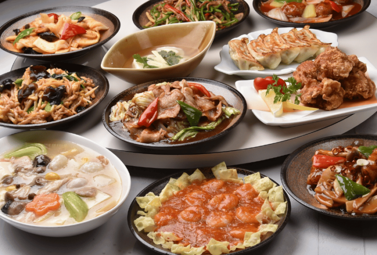 A dining table showcasing a variety of international dishes, each adorned with flags of different countries, perfectly represents the diverse flavors found in the Top 10 International Cuisines.